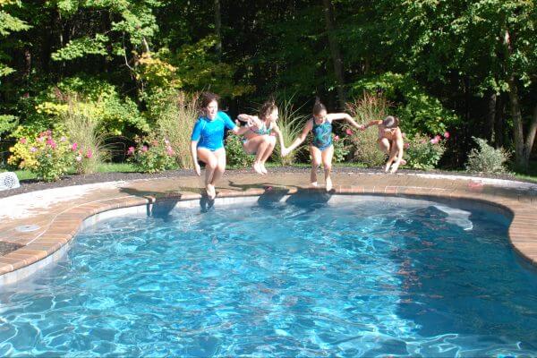 Kids Jumping into Swimming Pool